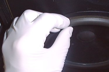Use of gloves to avoid grease deposits